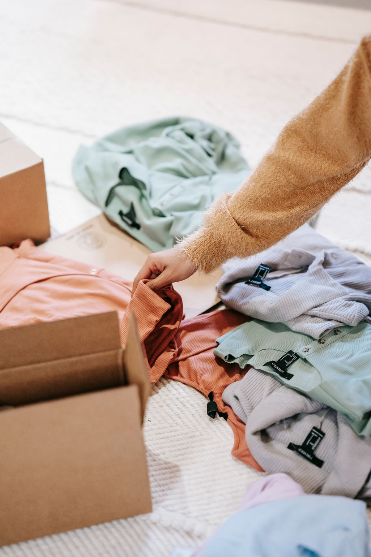 Clothes being carefully packed in a box